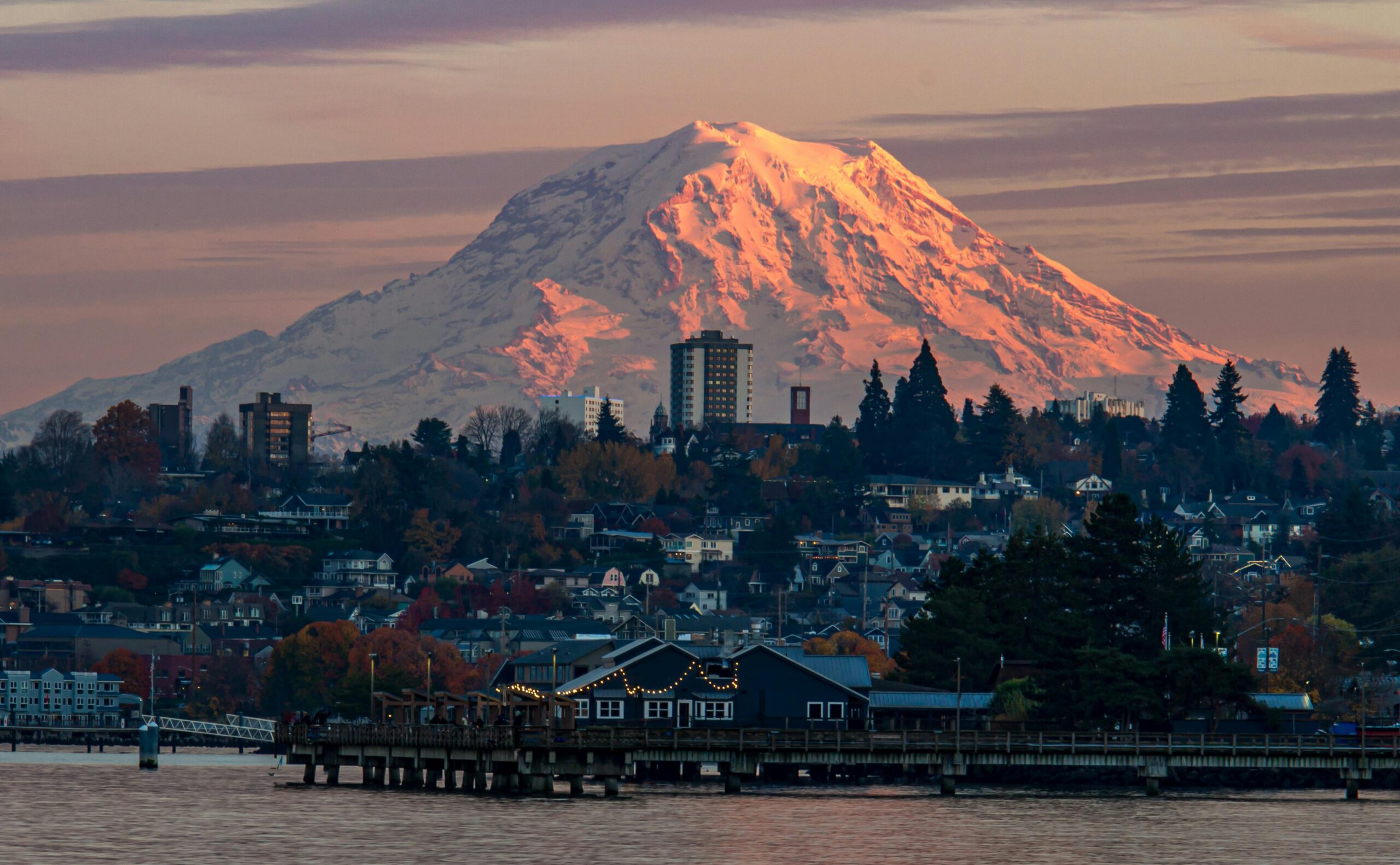pexels-photo-24288944-24288944 Sunset view of Mount Rainier towering over Tacoma's waterfront with vibrant autumn colors.